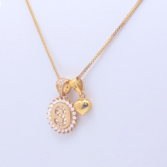 “S” pendant surrounded by white stones with a small heart charm. - Picture 3 of 3